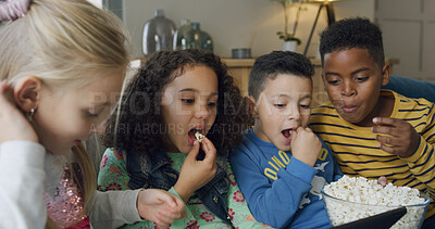 Buy stock photo Eating, popcorn and children with tablet, home and watching cartoons with friends and entertainment. Chilling, group and kids with snack for movies, subscription or streaming on website in house