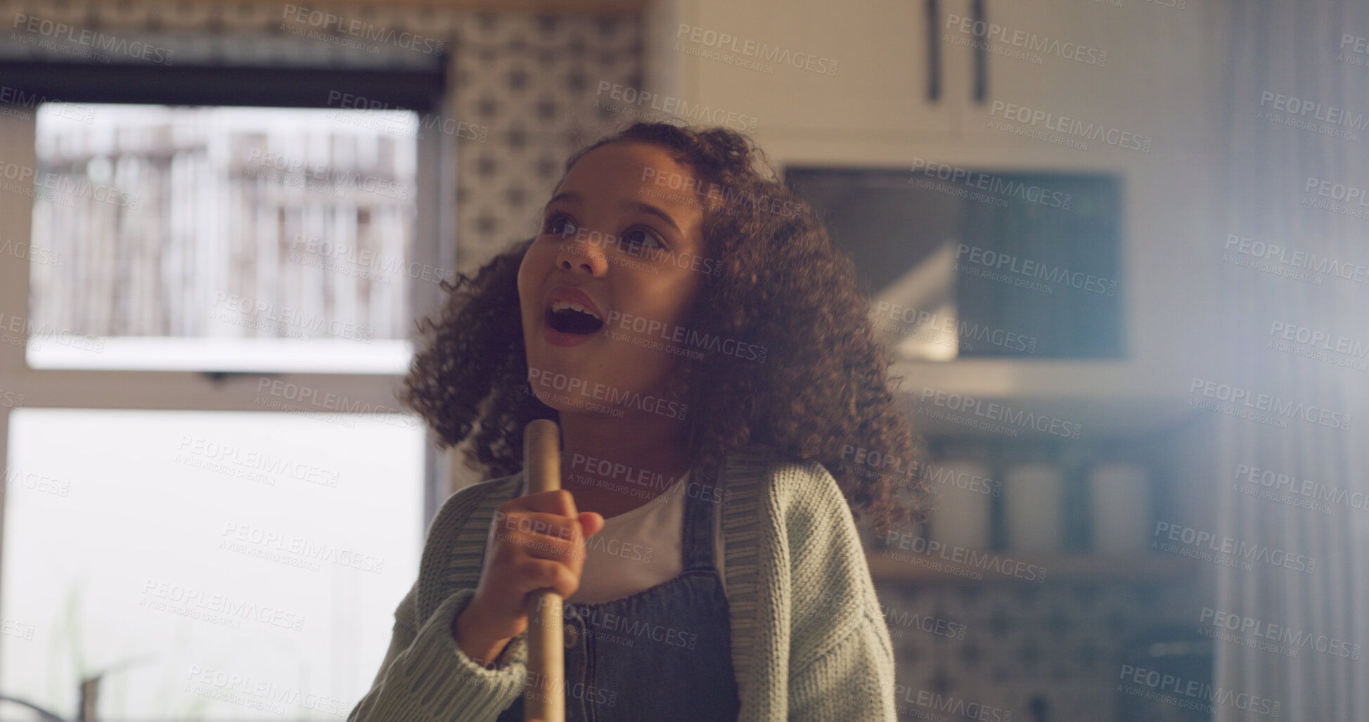Buy stock photo Singing, broom and child in kitchen for fun, music and happy while cleaning in home. Playful, childhood and girl with energy, karaoke and song for housekeeping, chore routine and hygiene on weekend