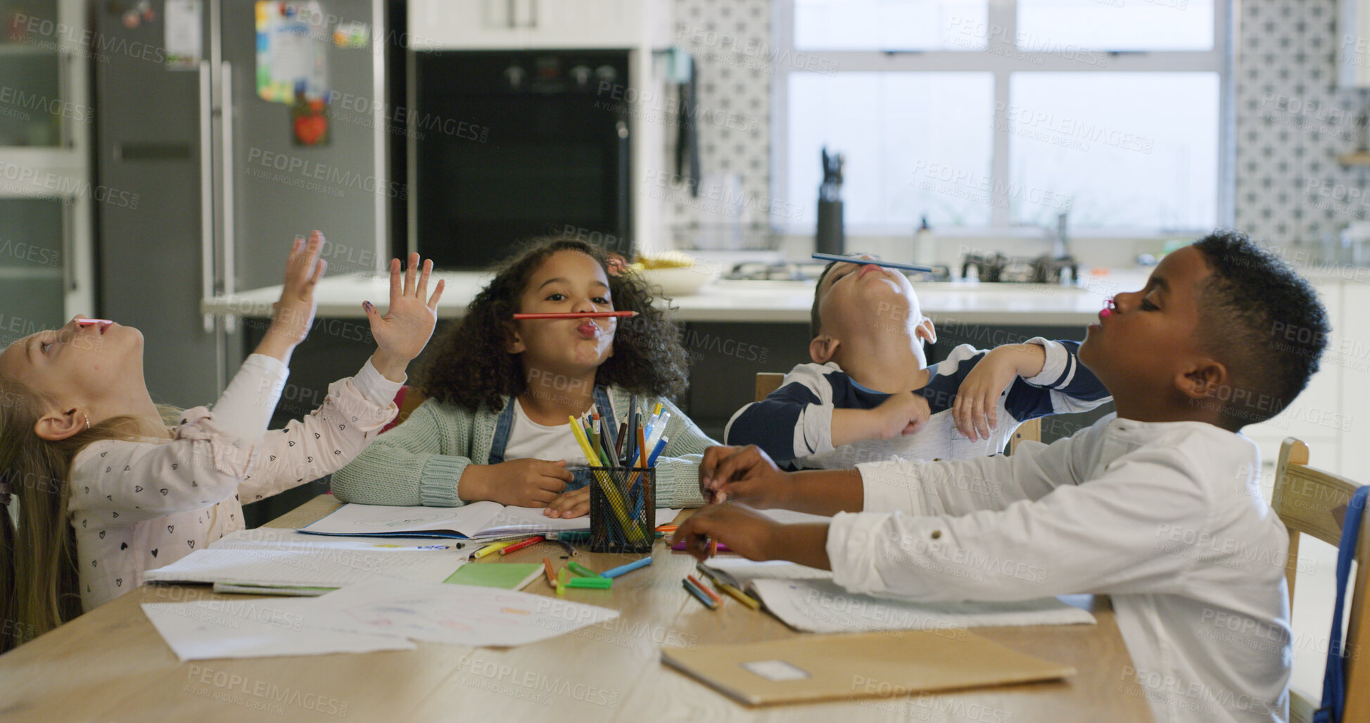 Buy stock photo Goofy, homework and children in house with pencils for funny joke, bored or comedy together. Education, learning and kid students with silly humor for working on school assessment in kitchen.