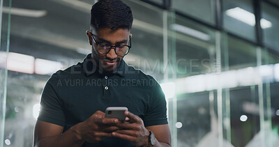 Buy stock photo Business, phone and reading with man in office at night for creative update or design deadline. App, communication and typing with designer in workplace for evening research or mobile text message