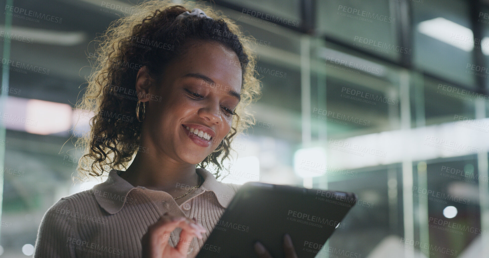 Buy stock photo Design, smile and tablet with business woman in office at night for creative research or planning. App, development and reading with happy designer in workplace for evening feedback or review