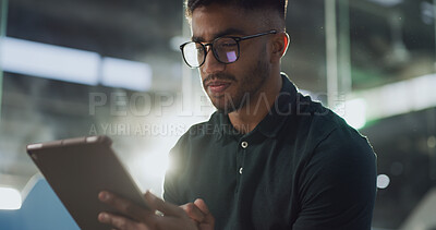 Buy stock photo Reading, tablet and waiting with man in terminal of airport for flight booking or travel schedule. Agenda, app and check in with passenger in lobby at night for communication, journey or trip