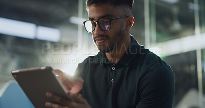 Buy stock photo Glasses, reading and tablet with man in terminal of airport for flight booking or travel schedule. Agenda, app and check in with passenger in lobby or waiting room at night for communication or trip