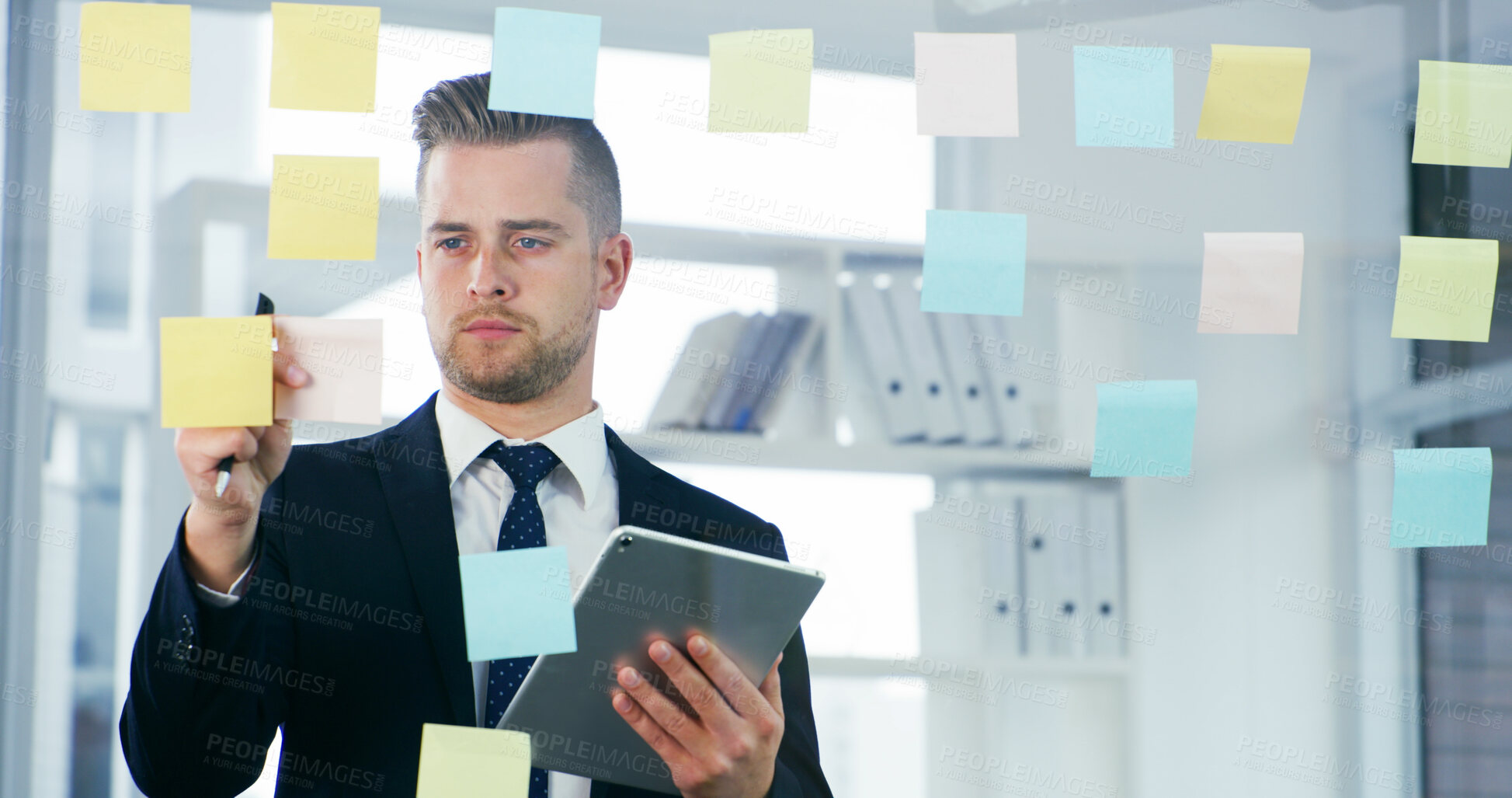 Buy stock photo Reading, sticky note and tablet with business man in office for mindmap, project calendar and brainstorming. Market research, glass and reminder with person in agency for online and moodboard