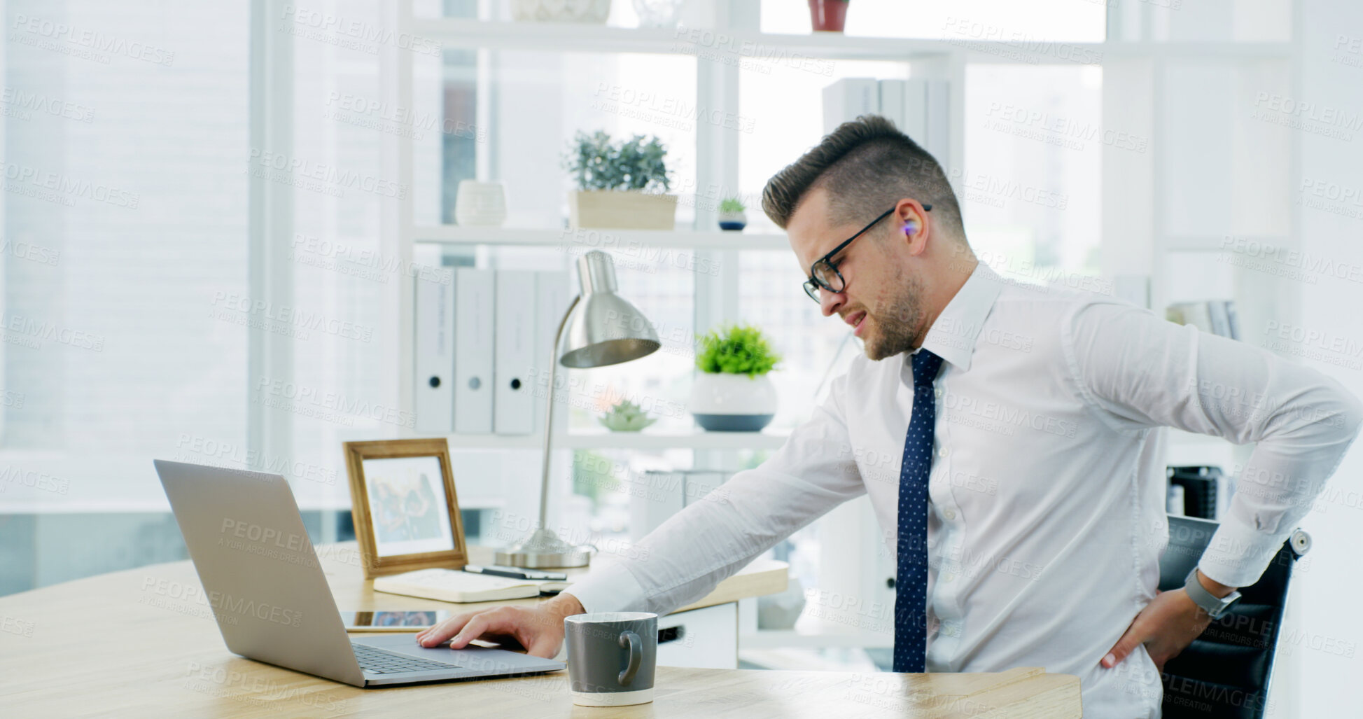 Buy stock photo Businessman, back pain and laptop at office, stress and frustrated with fibromyalgia at company. Person, computer and joint ache with massage, arthritis and burnout with injury at insurance agency
