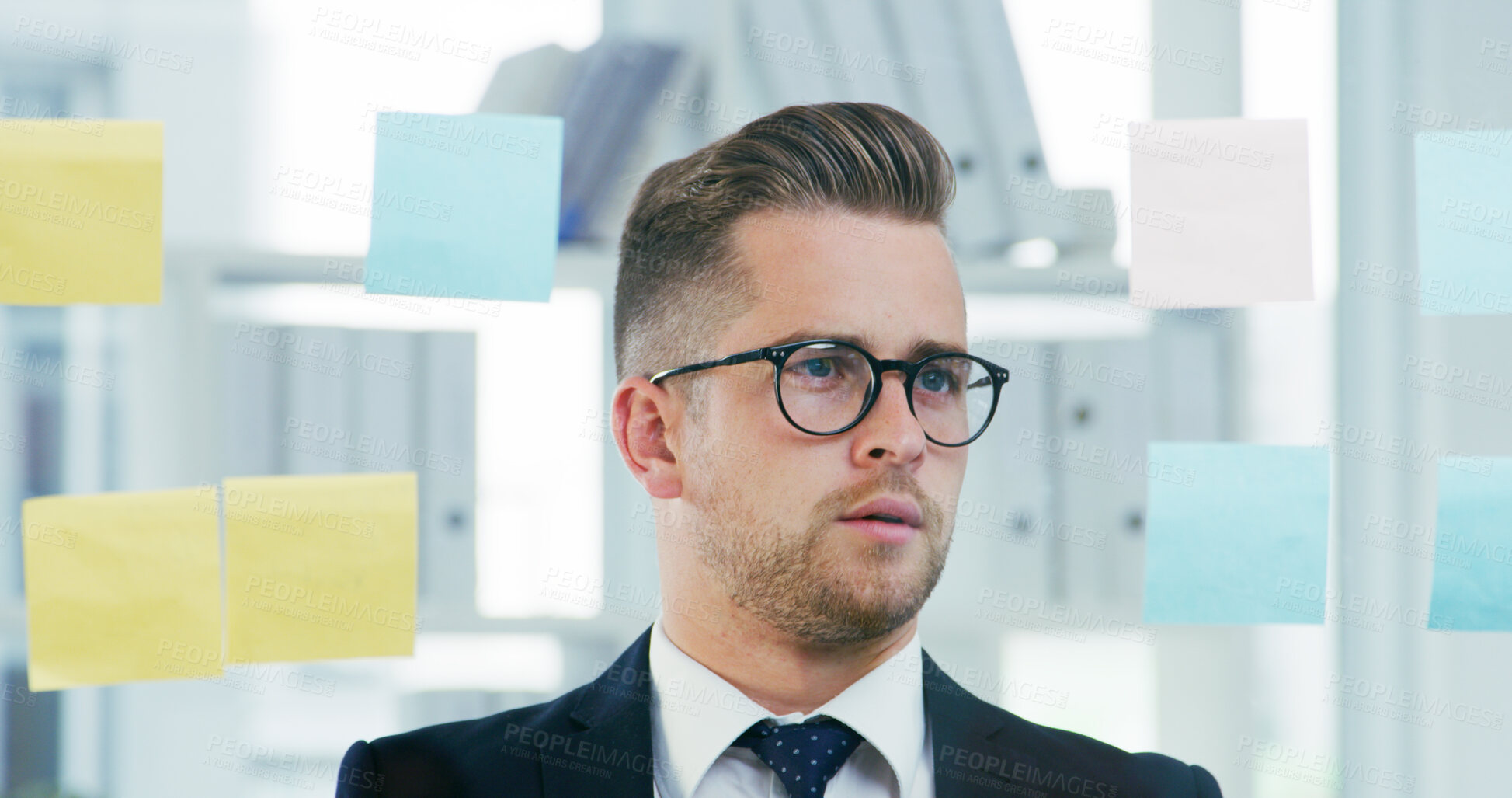 Buy stock photo Planning, sticky notes and storyboard with business man in office for brainstorming or solution. Development, glass wall and vision with employee in workplace for problem solving or strategy