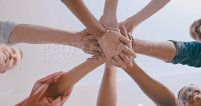 Buy stock photo Business people, meeting and team with hands together below in huddle for mission or collaboration. Low angle, group or employees with pile or stack in solidarity for trust, commitment or support