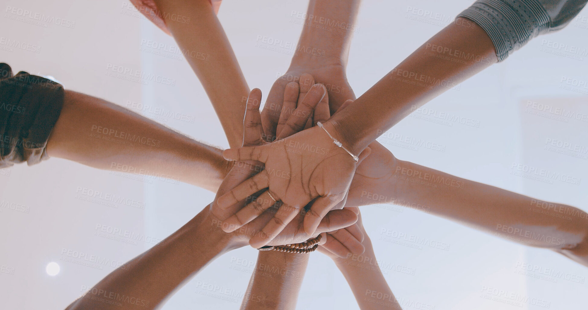 Buy stock photo Business people, meeting and below with hands together in huddle for mission or collaboration. Low angle, group or employees with pile or stack in solidarity for trust, commitment or team support