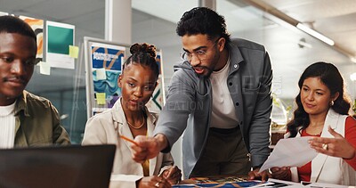 Buy stock photo Man, graphic designer and meeting with team at office for review, laptop or project management. Person, computer and group with solution for proposal, insight and point for advice at creative agency