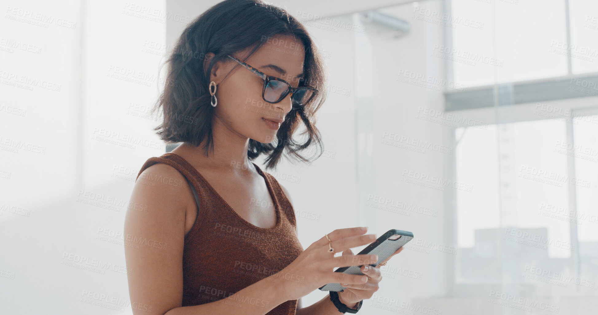 Buy stock photo Phone, office and business woman online for social media, internet news and browse website. Company, worker and person on smartphone for research, connection and email communication in lobby