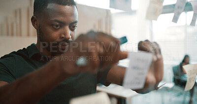 Buy stock photo Sticky note, black man and glass for planning, ideas or schedule for project management in office. Brainstorming, strategy and male employee by board for calendar, agenda and research at workplace