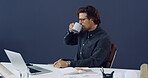 Laptop, coffee break and architect with notebook, blueprint and research of engineer in office. Reading, email and planning with architecture notes for construction project with design for contractor