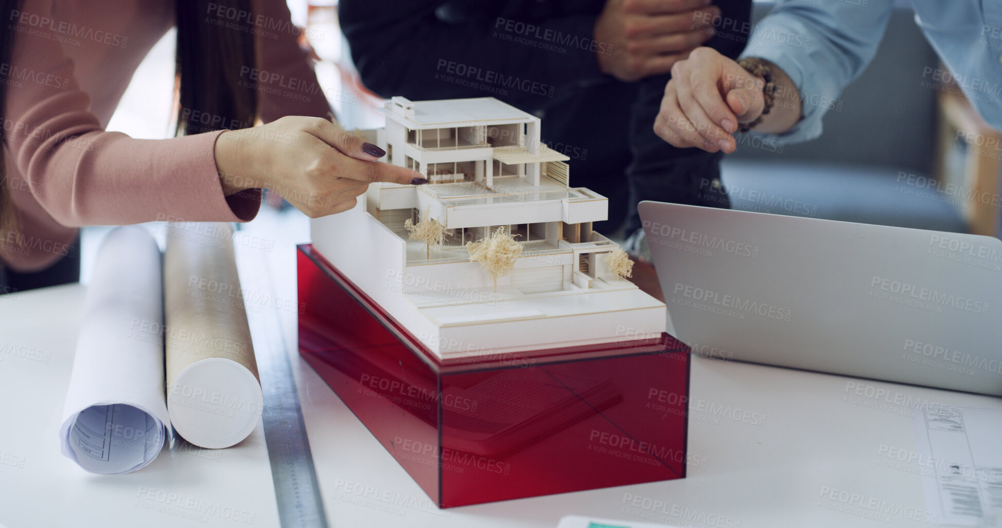 Buy stock photo Hands, architect and building model at meeting, point and review with laptop, blueprint or solution. People, group and project management for floor plan, real estate or property development at agency