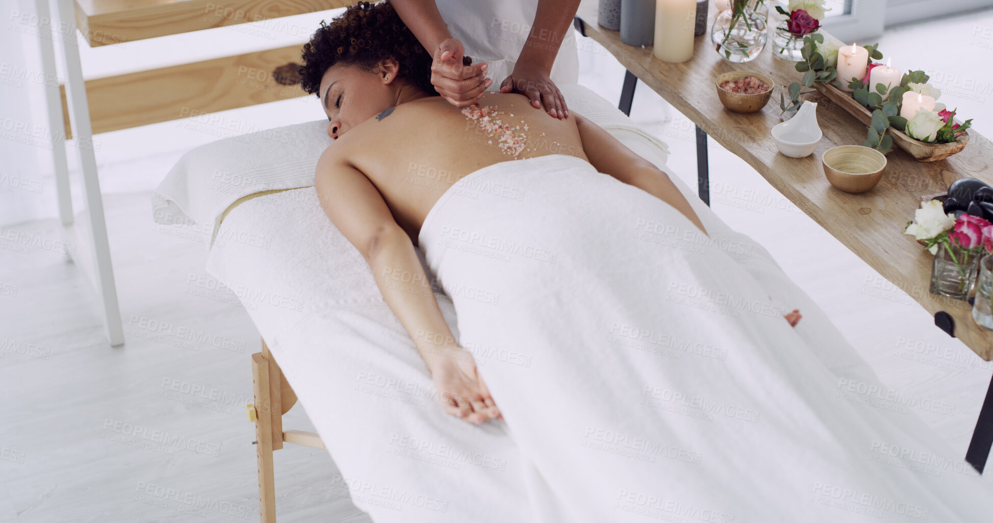 Buy stock photo Hands, masseuse and salt on person at spa for exfoliation, detox skin and luxury treatment. Above, people and cosmetic therapy for back scrub, body wellness and skincare healing with health benefits