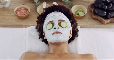 Buy stock photo Woman, face mask and cucumber at spa for beauty, relax and wellness with treatment for skincare. Girl, above and facial cream with organic fruit for benefits, anti aging or dermatology at resort