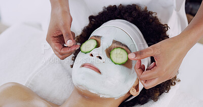 Buy stock photo Woman, mask and cucumber at spa with hands, relax or skin treatment with care at lodge. Girl, rest and bed with facial cream for benefits, organic fruit and anti aging with dermatology at resort