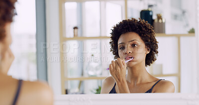 Buy stock photo Woman, mirror and toothbrush for dental in house, teeth and gum cleaning for hygiene, wellness and health. African person, oral care and brush for whitening, morning routine and reflection at home