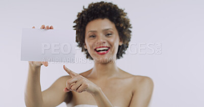 Buy stock photo Pointing, beauty or happy woman with board for skincare, space or cosmetics on white background. Portrait, smile or African person in advertising studio with dermatology banner, card or poster mockup