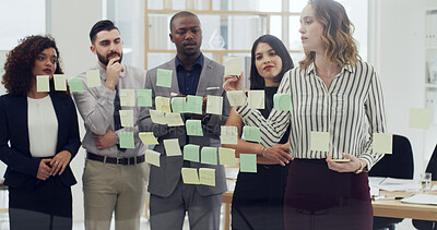 Buy stock photo Sticky notes, teamwork and business people writing in office with planning for company budget report. Thinking, glass wall and financial managers with research for investment proposal in workplace.