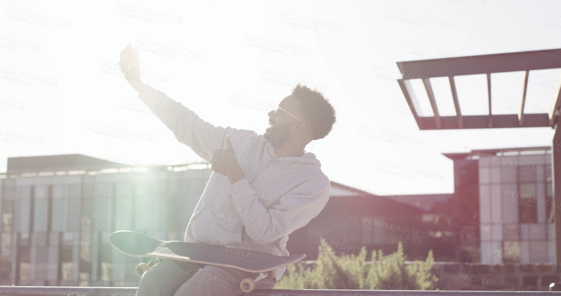 Buy stock photo African man, skateboard and selfie on ramp at park in city, smile and post on web in summer. Person, skater and influencer with photography, excited and extreme sports on social network in Kenya