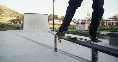 Buy stock photo Skateboard, skater and legs with balance on rail for grind stunt, performance challenge and skill. Extreme sport, person and skating at skatepark for workout, hobby and practice action trick at ramp