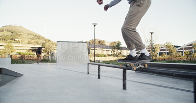 Buy stock photo Man, skateboard and stunt in city, railing and fitness with trick, training and extreme sports. Skater, outdoor and person with practice, exercise and urban town with challenge or hobby in Canada