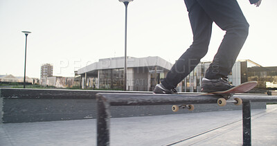 Buy stock photo Man, skateboard and trick with legs, railing or fitness with hobby, training or extreme sport. Skater, outdoor or person with practice, exercise or stunt performance with shoes or challenge in Canada