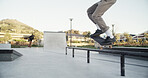 Skateboard, man and legs with balance on rail for grind stunt, performance challenge and skill. Skater, person and extreme sport at skatepark for physical activity, hobby and practice action trick