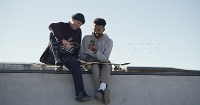 Buy stock photo Phone, streaming and search with friends at skate park for social media, learning tricks and relax. Stunt tutorial, online skater channel and communication with people in city for hobby and space