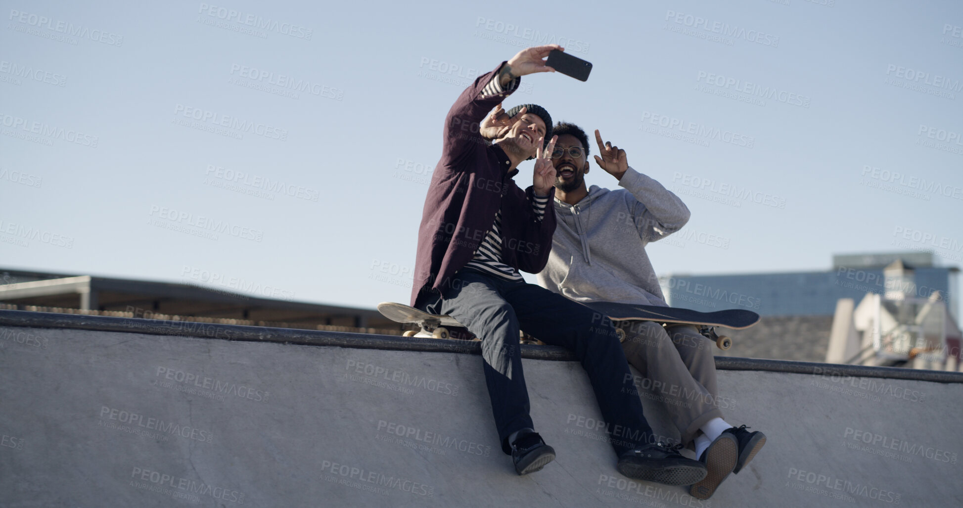 Buy stock photo Men, friends and selfie on ramp at skate park, smile or hug with sky, memory and web post in town. People, embrace and happy skater with photography, low angle and extreme sports on social network
