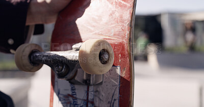 Buy stock photo Skateboard, sports and hands of person in skatepark for hobby, balance and fitness in city. Wheels, space and male skater with longboard for exercise, equipment and training outdoors for wellness