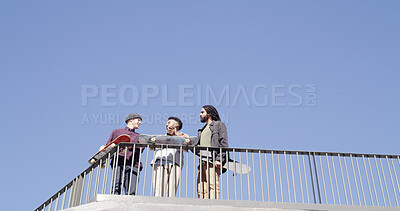 Buy stock photo Below, people and together with skateboard, phone and bonding on blue sky space. Conversation, friends and gen z skater group with tech, smile and social media for fitness hobby and break for sport