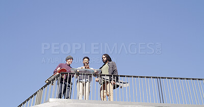 Buy stock photo Men, skateboard and phone with blue sky below for social media, network or tips and tricks. Low angle, male people or group of friends with mobile smartphone for spot in an urban skate park on space