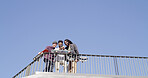 Friends, skateboard or men with phone outdoor for skating video, social media post or practice break. Mockup, blue sky or skaters with smartphone at skatepark for watching online stunt and low angle