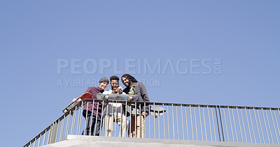 Buy stock photo Friends, skateboard or men with phone outdoor for skating video, social media post or practice break. Mockup space, blue sky or skaters with smartphone at skatepark for watching online stunt or below
