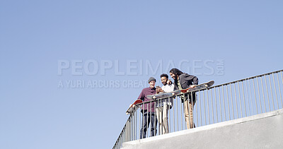 Buy stock photo Below, people and laugh with skateboard, phone and meme together on blue sky space. Bonding, friends and gen z skater group with tech, smile and social media for fitness hobby and break for sport