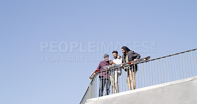 Buy stock photo Below, friends and together with skateboard, phone and bonding on blue sky space. Conversation, people and gen z skater group with tech, smile and social media for fitness hobby and break for sport