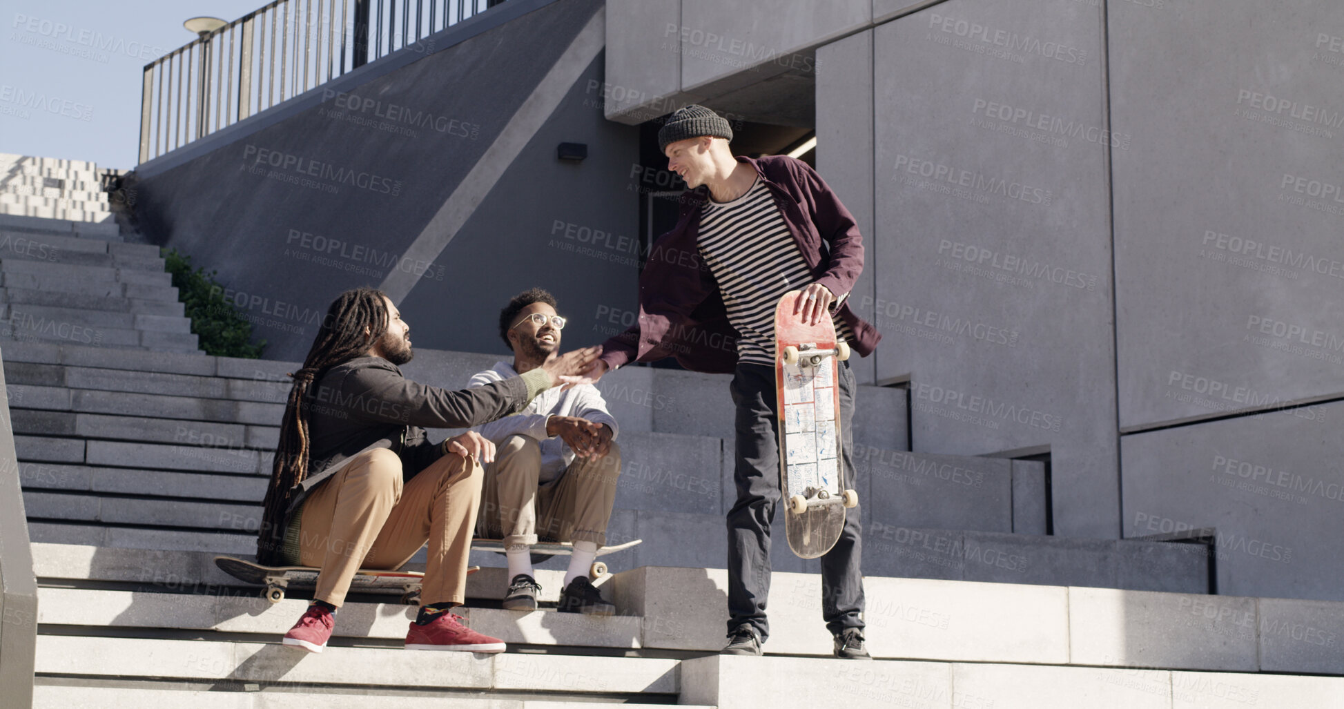 Buy stock photo Skater friends, hello and men in city for greeting, bonding and handshake for conversation. Outdoor park, stairs and people with skateboard for activity, skating hobby and training together in town