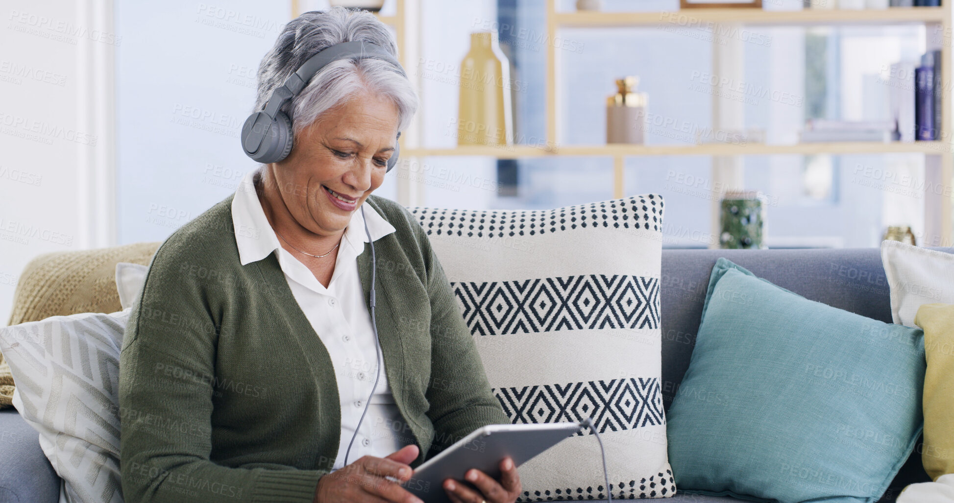 Buy stock photo Old woman, relax and headphones with tablet on sofa for streaming movie, online film and podcast. Retirement, senior person and happy with digital app in home for listening to audio playlist or video