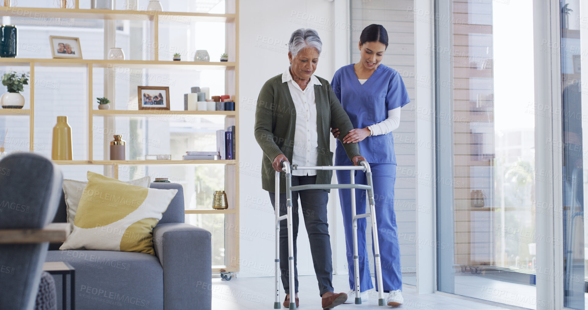 Buy stock photo Walker, helping and nurse with senior woman for support, rehabilitation or physical therapy in house. Mobility aid, healthcare and caregiver with elderly female person with disability in nursing home