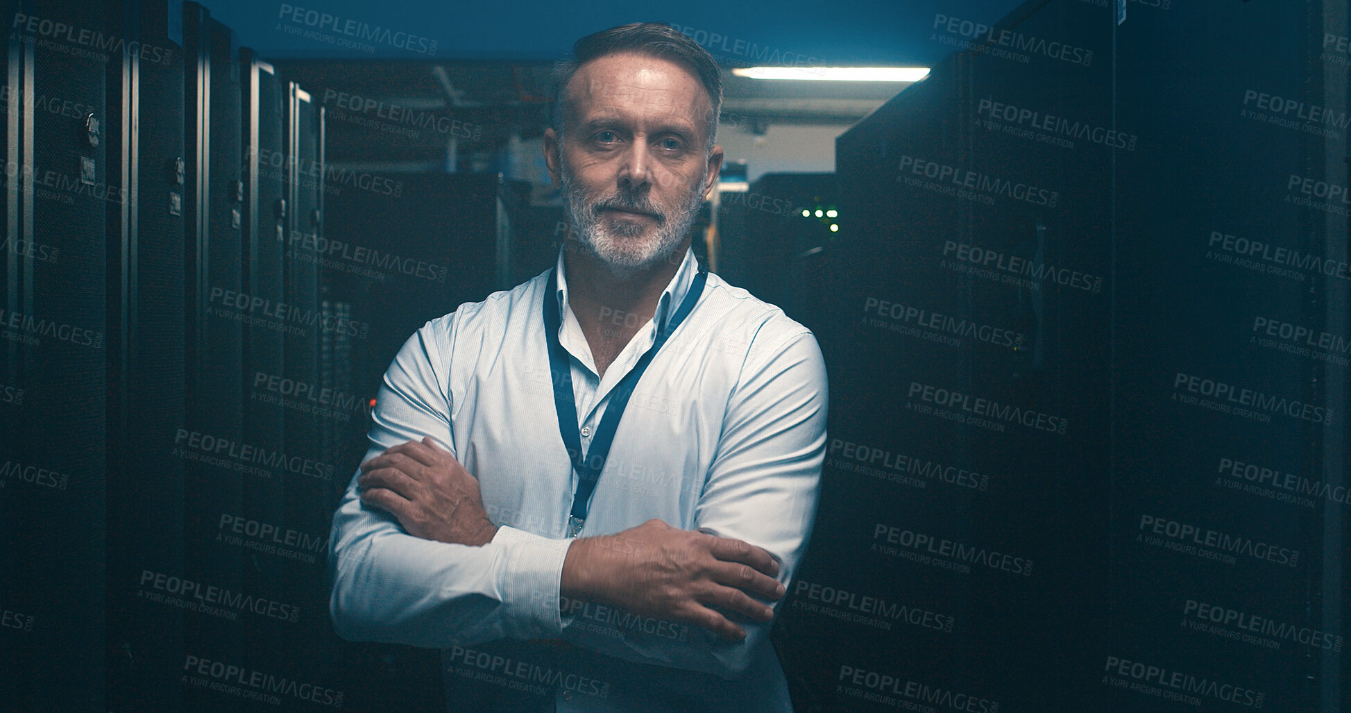 Buy stock photo Arms crossed, mainframe and portrait of man in server room for network administration. Cloud computing, cybersecurity and system with mature tech support employee in data center for maintenance