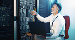 Cable, technician and laptop with man in server room for hosting database, inspection and cybersecurity. Hardware storage, cloud computing and system backup with mature person in data center