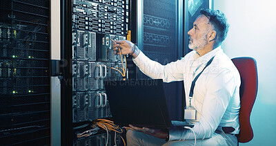 Buy stock photo Cable, technician and laptop with man in server room for hosting database, inspection and cybersecurity. Hardware storage, cloud computing and system backup with mature person in data center