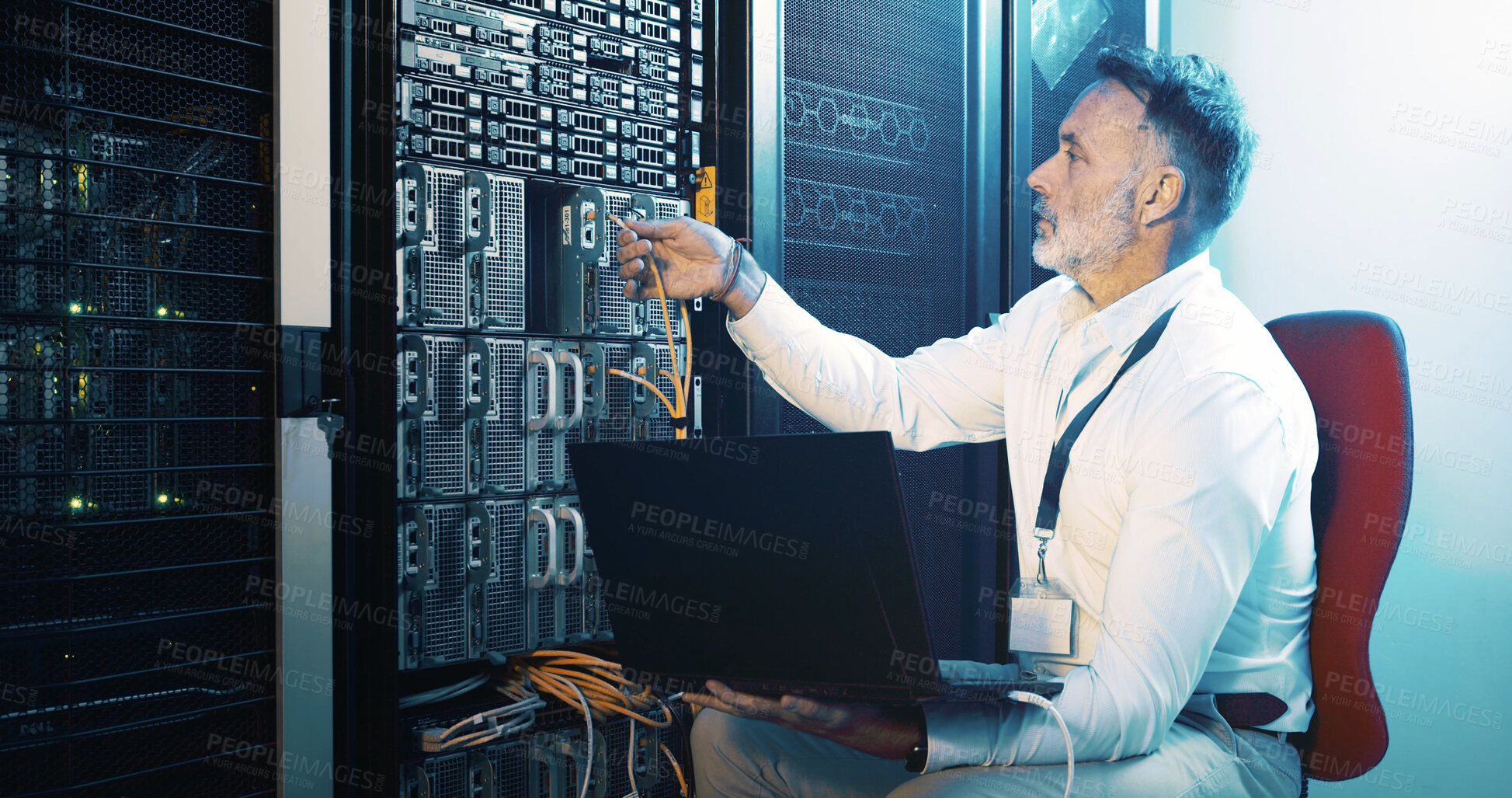 Buy stock photo Cable, technician and laptop with man in server room for hosting database, inspection and cybersecurity. Hardware storage, cloud computing and system backup with mature person in data center