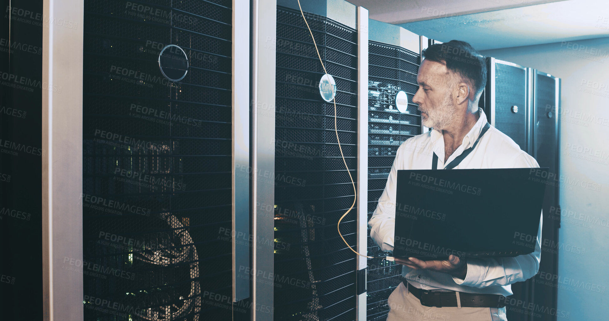 Buy stock photo Server room, programmer and man with laptop, inspection and hardware problem solving. IT specialist, mature person or employee with pc, cyber security and tech upgrade with maintenance or control box