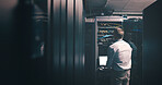 Technician, back and laptop with man in server room for cybersecurity, network and system database. Software update, signal transmission and cloud computing with person in data center for maintenance