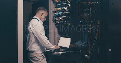 Buy stock photo Update, technician and laptop with man in server room for hosting database, inspection and cybersecurity. Hardware storage, cloud computing and system backup with mature person in data center