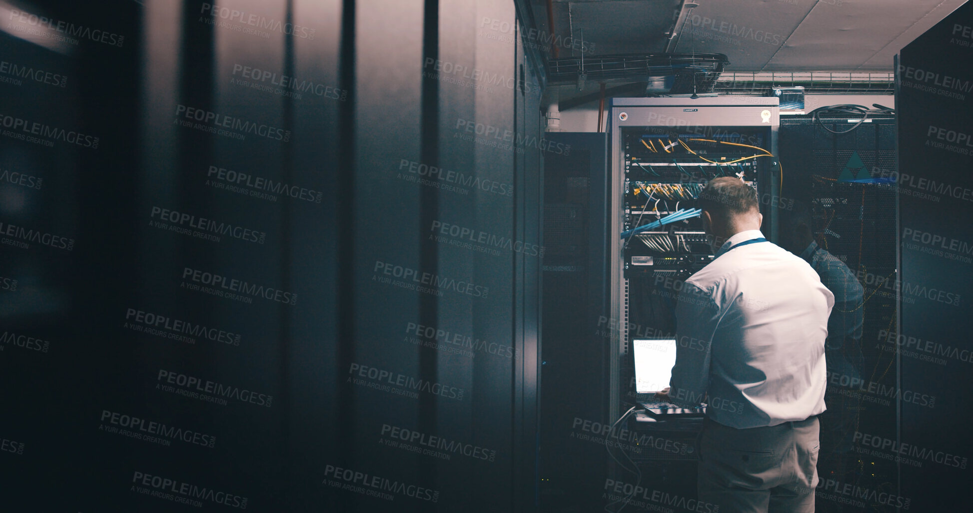Buy stock photo Engineer, technician and laptop with man in server room for hosting database, inspection and cybersecurity. Hardware storage, cloud computing and system backup with mature person in data center