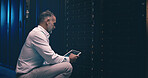 Tablet, developer and technician or man in server room for cyber security, software update and database system. Programmer, maintenance and cybersecurity with mature person in data center as engineer