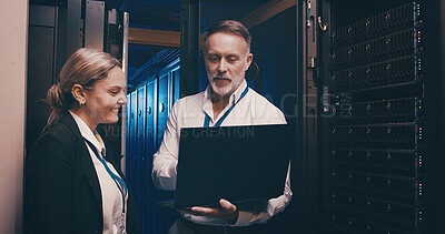 Buy stock photo Server room, talking and people on laptop for network maintenance, IT support and database. Cybersecurity, technician team and man with woman on computer for diagnostics, system update and backup